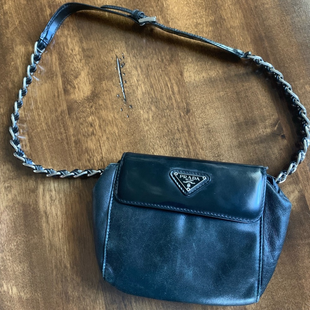 Vintage black Prada shoulder bag with flap.